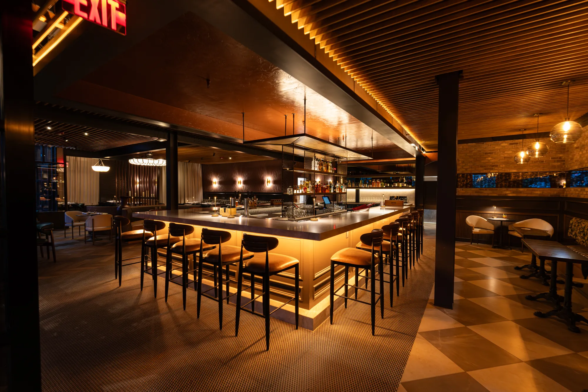 Restaurant bar seating under neon light